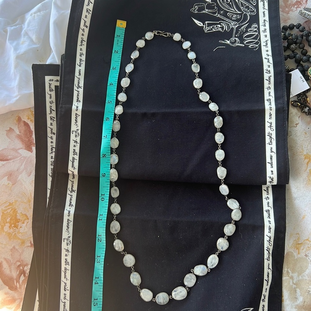 Long necklace in silver and white stones. Classy and elegant for fun or work.